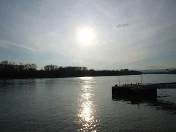 Scenic view of lake at sunset