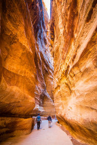 People walking in cave