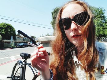 Close-up of young woman in sunglasses