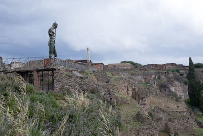 Old ruin building against cloudy sky