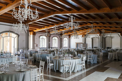 Decorated room with tables and chairs for event