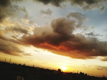 Scenic view of dramatic sky during sunset