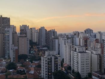 High angle view of buildings against sky during sunset