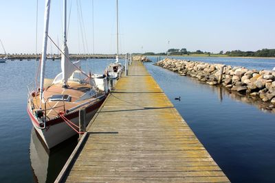 Pier over sea against clear sky