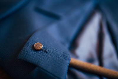 Close-up of button on blazer