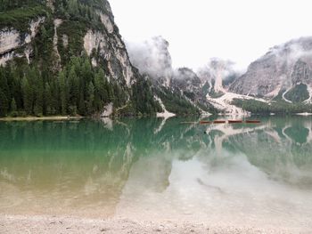 Scenic view of lake and mountains against sky