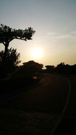 Empty road at sunset