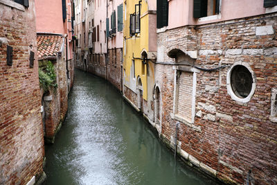 Canal amidst buildings