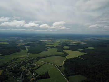 Aerial view of agricultural landscape against sky