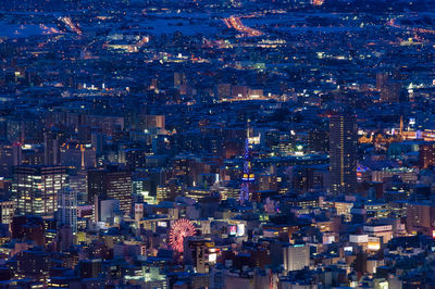 Aerial view of illuminated cityscape at night