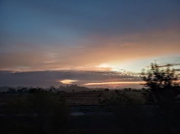 Scenic view of silhouette landscape against sky during sunset