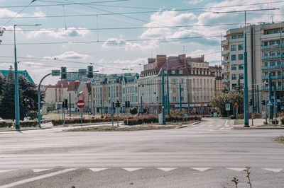 City street and buildings against sky