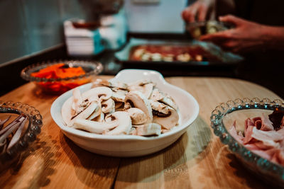 Close-up of person preparing food on table