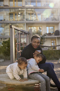 Smiling woman with children