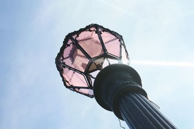 Low angle view of antique street light against sky