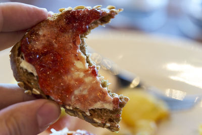 Close-up of hand holding food