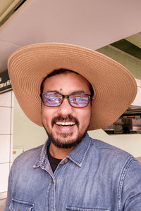 Portrait of young man wearing hat