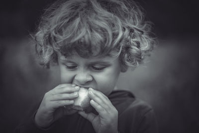 Portrait of boy eating food