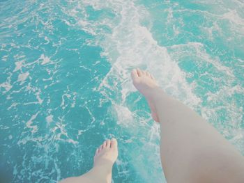 Low section of woman in swimming pool