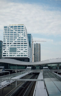 Modern buildings against sky in city