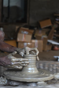 Cropped hand of man working at workshop