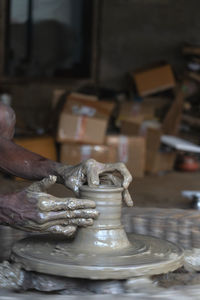 Cropped hand of man working at workshop