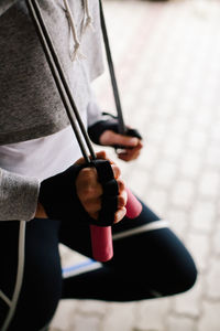 Midsection of woman exercising in gym