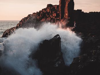 Scenic view of sea against sky at sunset