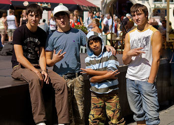 Full length portrait of friends standing outdoors