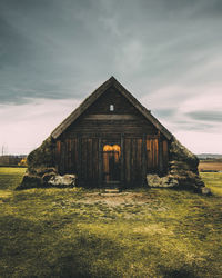 House on field against sky