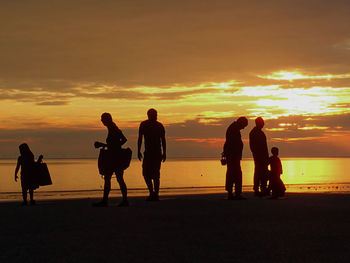 Silhouette people at beach