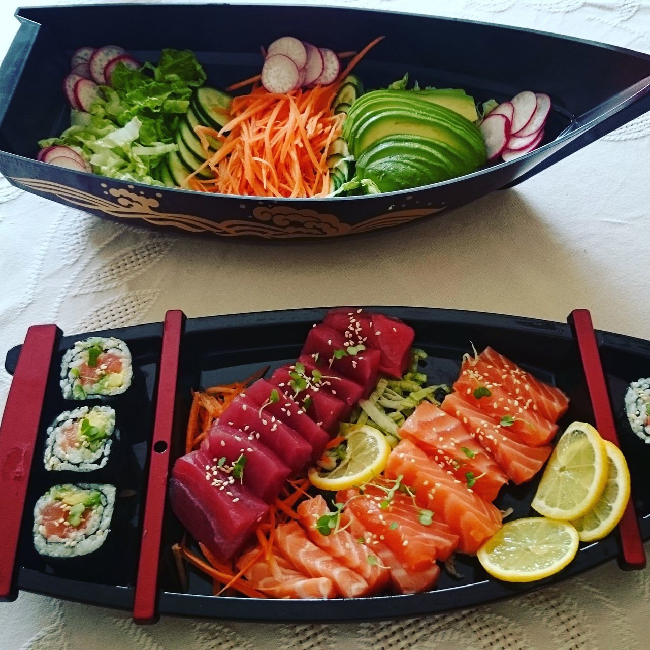 food and drink, food, freshness, indoors, healthy eating, still life, table, vegetable, high angle view, ready-to-eat, variation, meat, plate, tomato, meal, salad, serving size, slice, cutting board, sushi