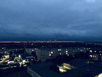 High angle view of illuminated buildings in city at night