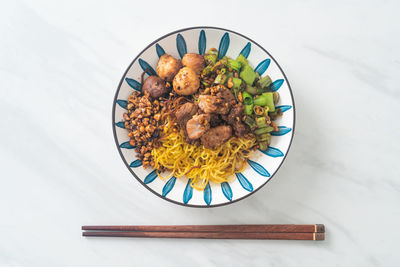 Directly above shot of food in plate on white background