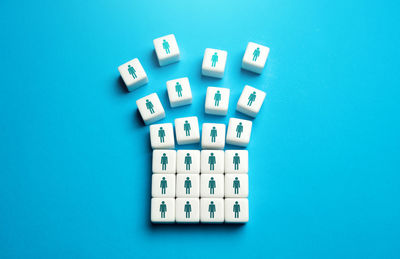 Directly above shot of dices on blue background