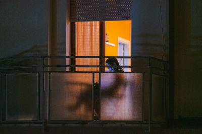 Reflection of people sitting on glass window