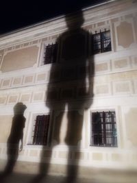 Shadow of person on window