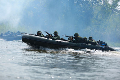 Army soldiers river rafting 
