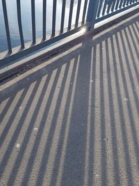 High angle view of shadow on sand at beach