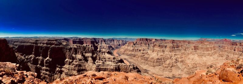 View of rock formations against blue sky