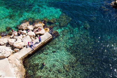 High angle view of people by sea