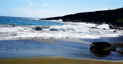 Scenic view of sea against blue sky