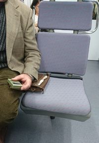 Midsection of man using mobile phone