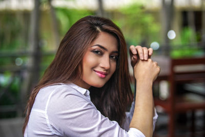 Portrait of young woman looking away