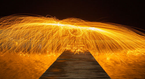 Light painting against sky at night