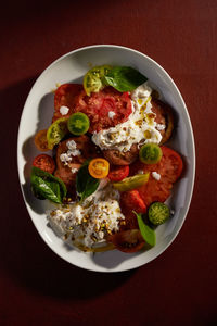 Salad with different varieties of tomatoes and stracciatella,