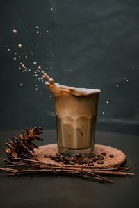 Close-up of coffee splashing in glass