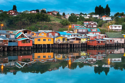 Reflection of houses and buildings in river