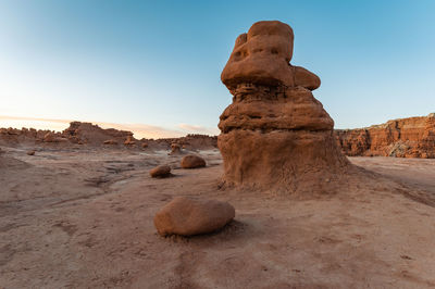 Rock formations in desert against clear sky