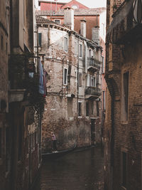 Canal amidst buildings in town